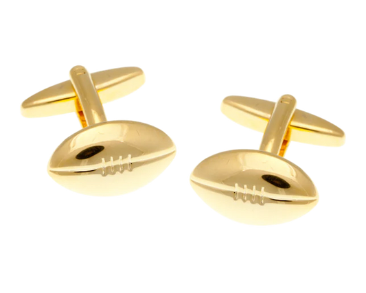 gold rugby ball cufflinks on white background