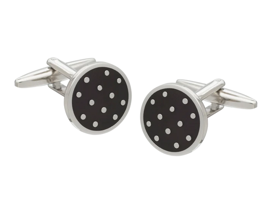 Round cufflinks with black background and white dots on a white background