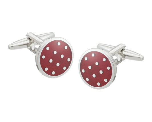Cufflinks with red circular design and white polka dots on a white background