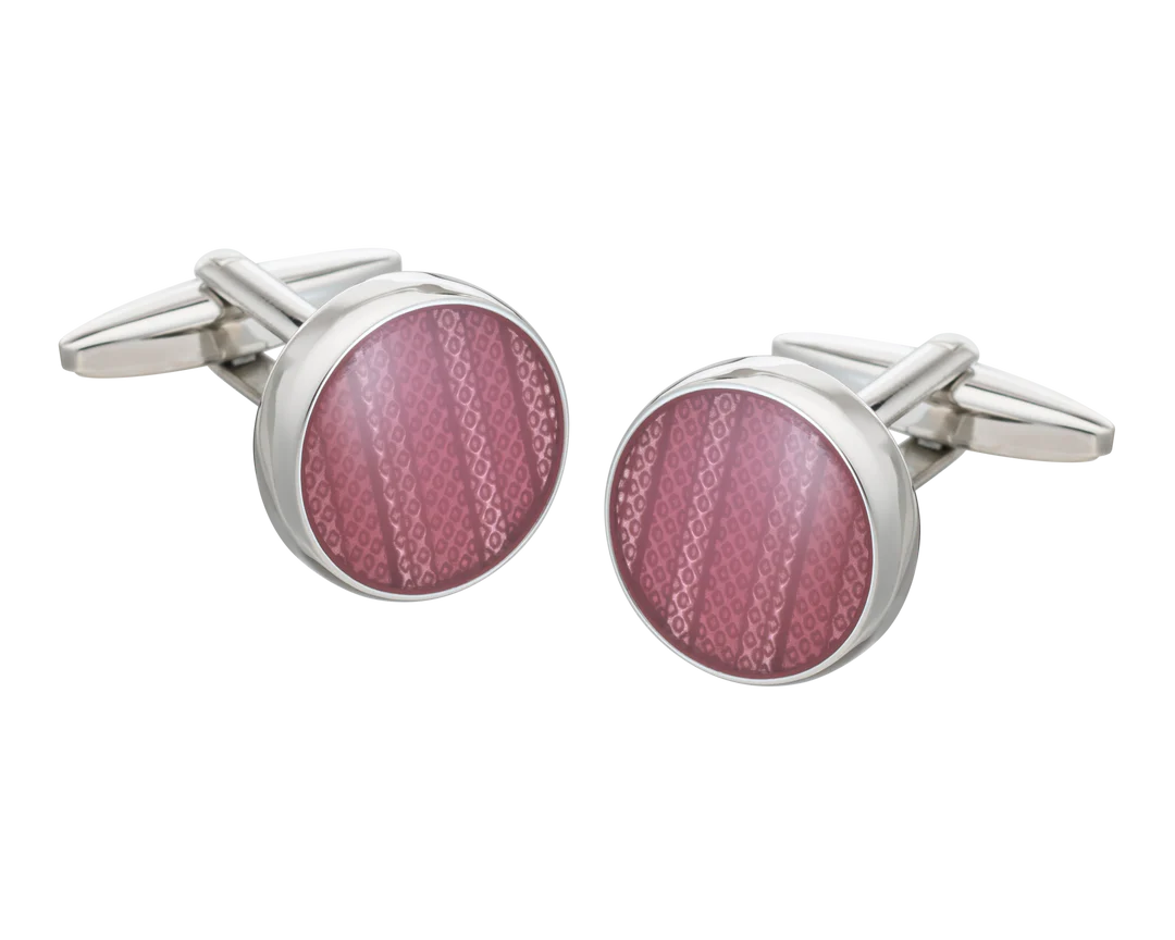 round pink cufflinks on white background