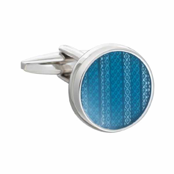 Cufflink with blue patterned design on a white background