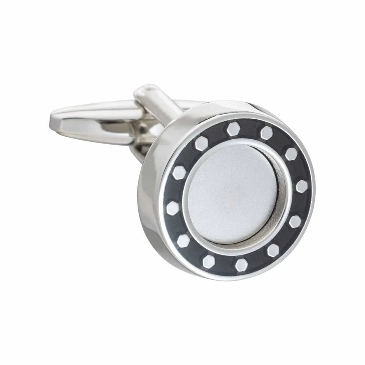 Silver cufflink with black and white design on a white background
