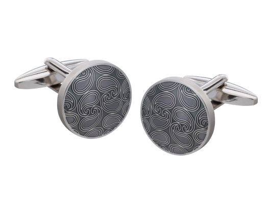 Silver cufflinks with a black pattern on a white background