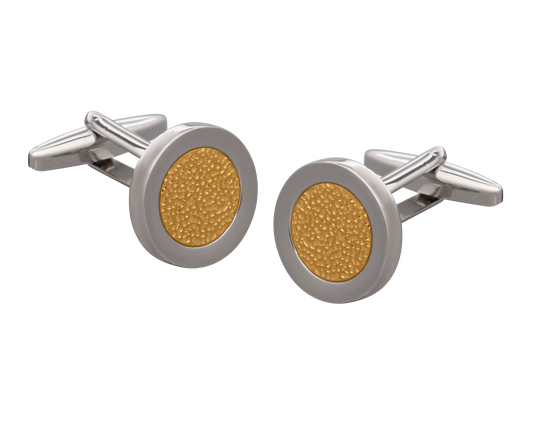 Gold and silver cufflinks on a white background