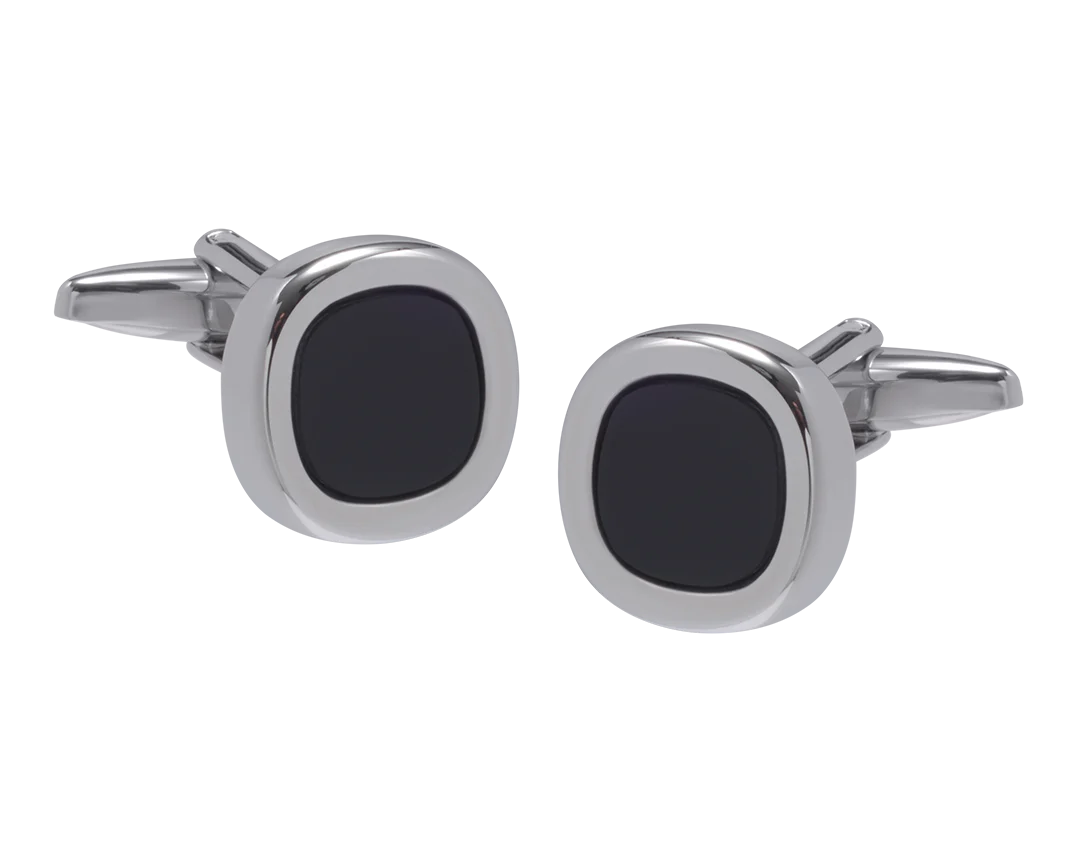 Cufflinks with black stones and silver metal on a white background