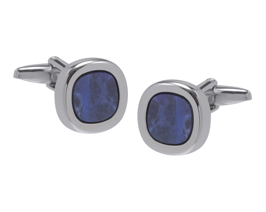 Cufflinks with blue circular stones on a white background