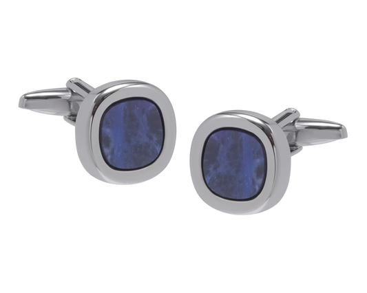 Cufflinks with blue circular stones on a white background