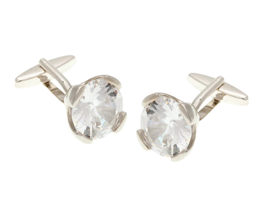 Silver cufflinks with clear gemstones on a white background