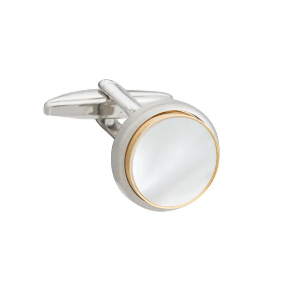 Silver and gold cufflink on a white background