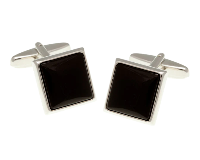Pair of square black cufflinks with silver borders on a white background