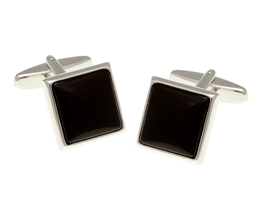 Pair of square black cufflinks with silver borders on a white background