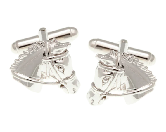 Silver horse head cufflinks on a white background
