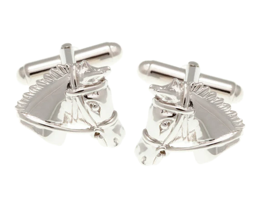 Silver horse head cufflinks on a white background
