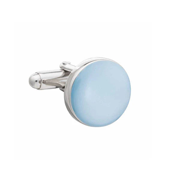 Cufflink with light blue circular stone and silver frame on a white background
