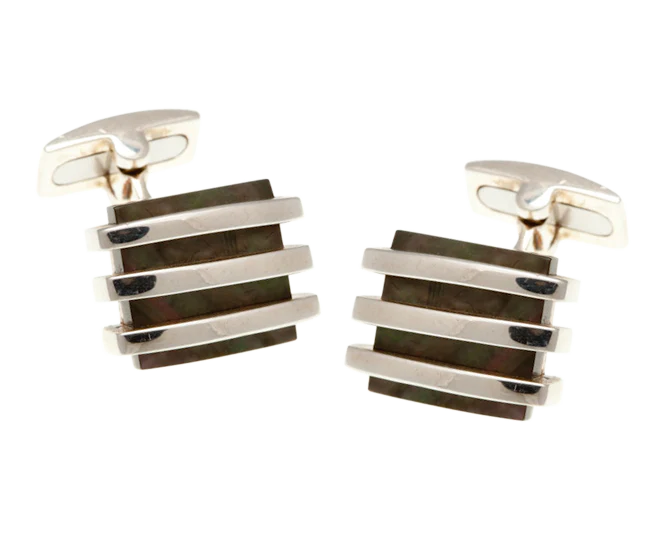 Pair of silver and black striped cufflinks on a white background