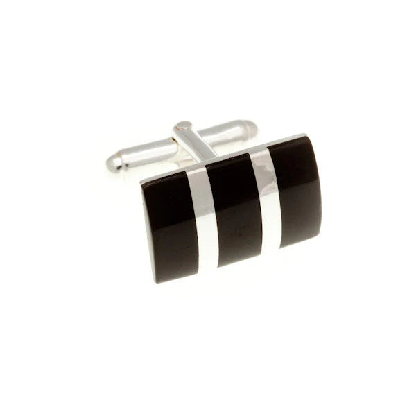Black and silver cufflinks on a white background