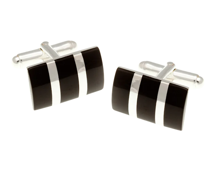 Black and silver cufflinks on a white background