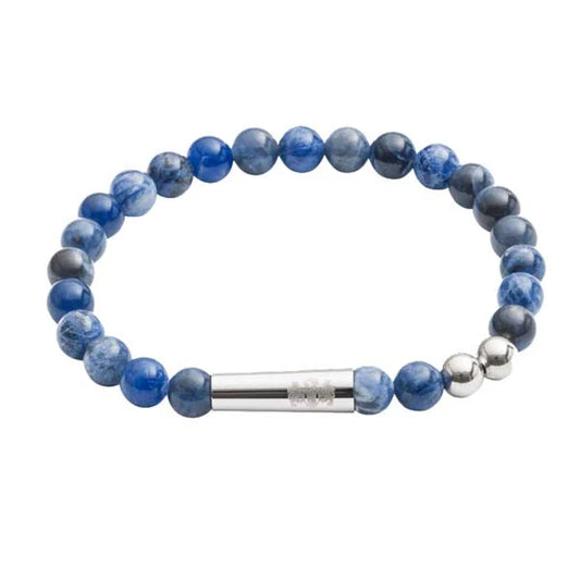 Blue beaded bracelet with a silver cylindrical clasp on a white background