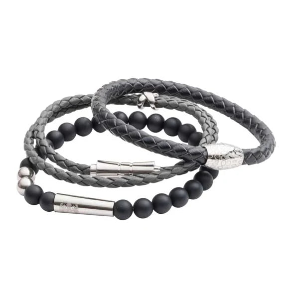 Three braided bracelets with black beads on a white background