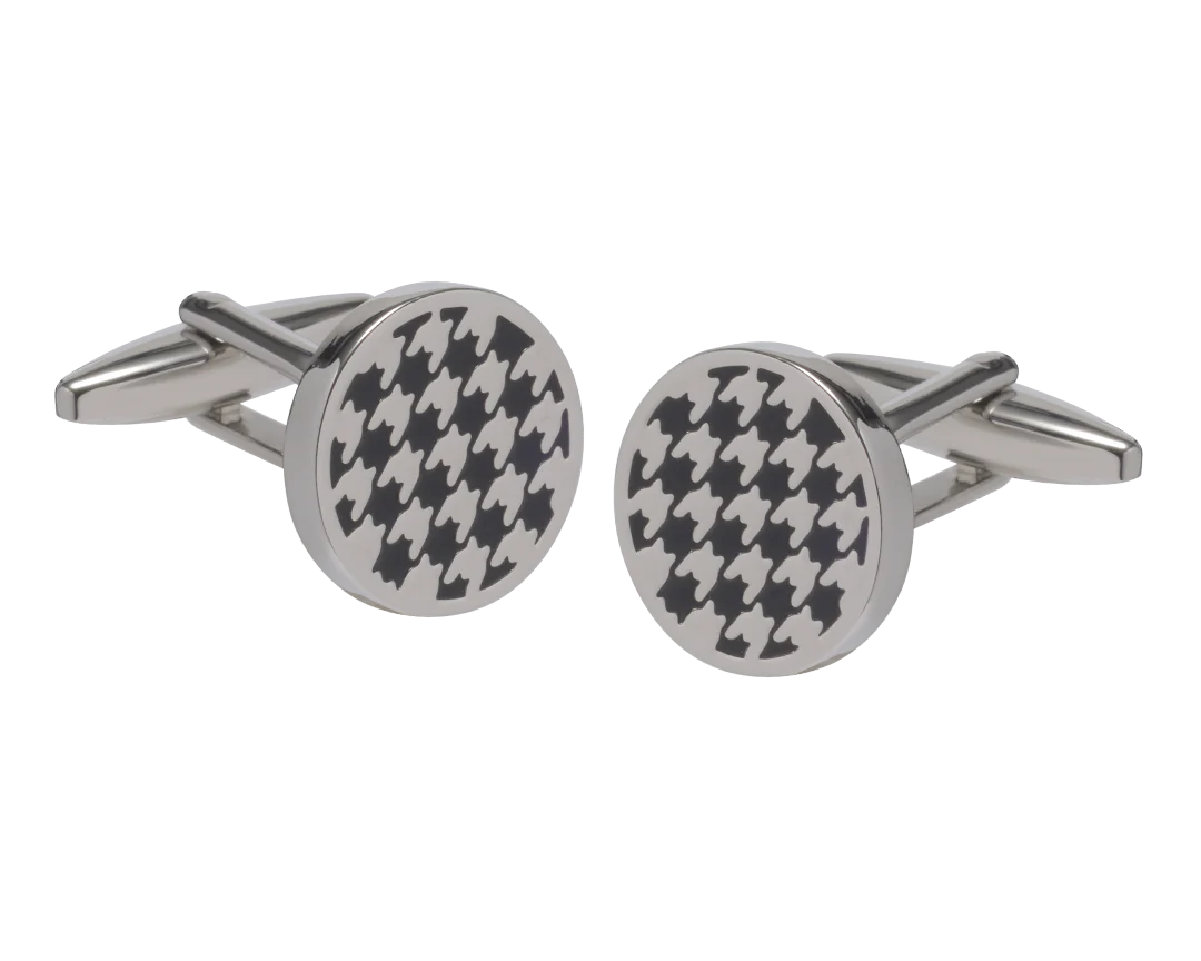 Round silver cufflinks with black houndstooth pattern on a white background