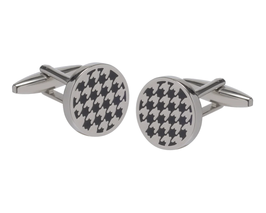 Round silver cufflinks with black houndstooth pattern on a white background