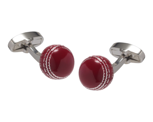 Cufflinks designed like a red cricket ball with silver metal loops on a white background