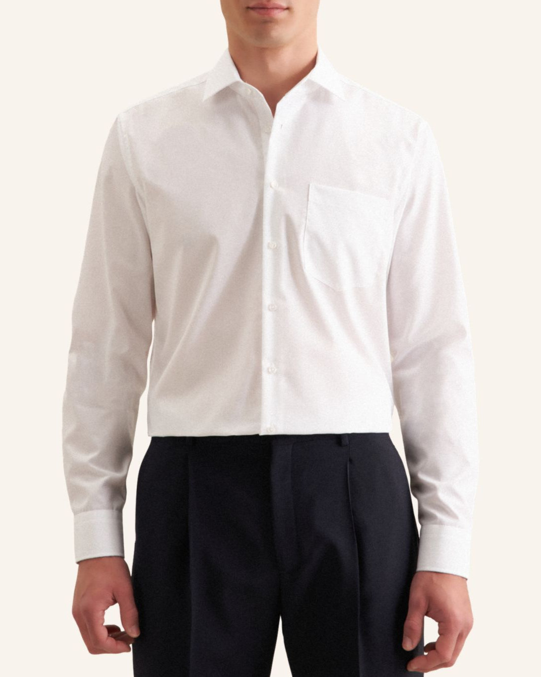 White dress shirt and black pants on a white background