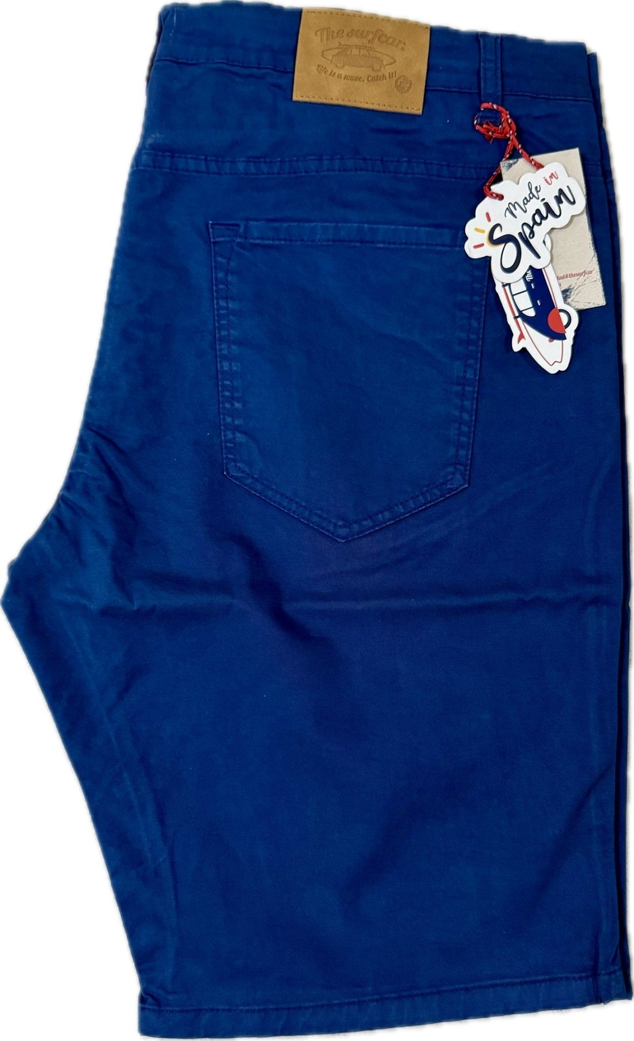 Blue shorts with a brand tag on a white background