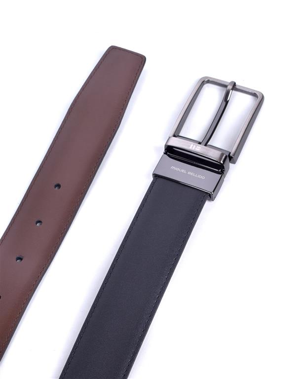 Brown and black leather belts with silver buckles on a white background