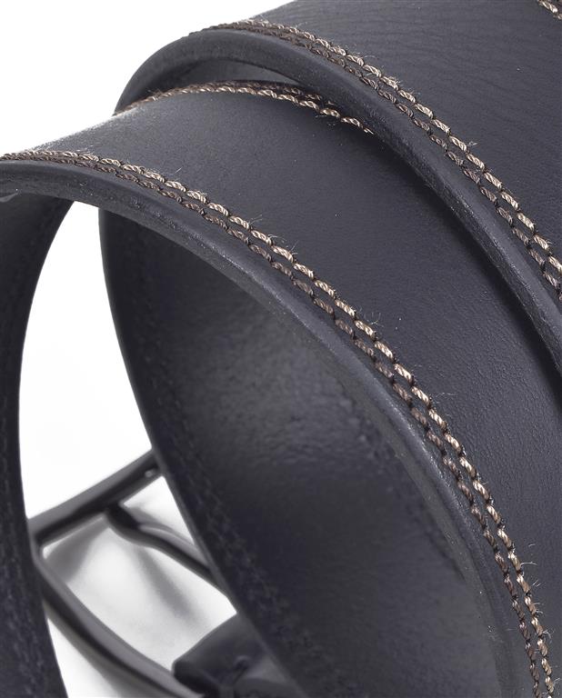 Close-up of a black leather product with stitching detail on a white background