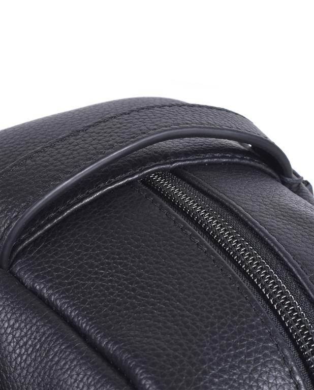 Close-up of a black leather bag with a zipper on a white background