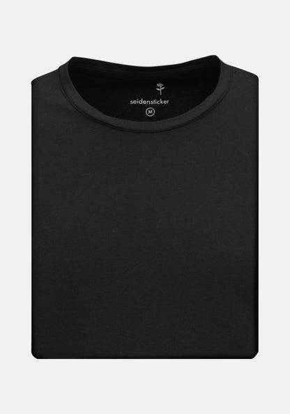 Folded black t-shirt with 'seidensticker' branding on a white background