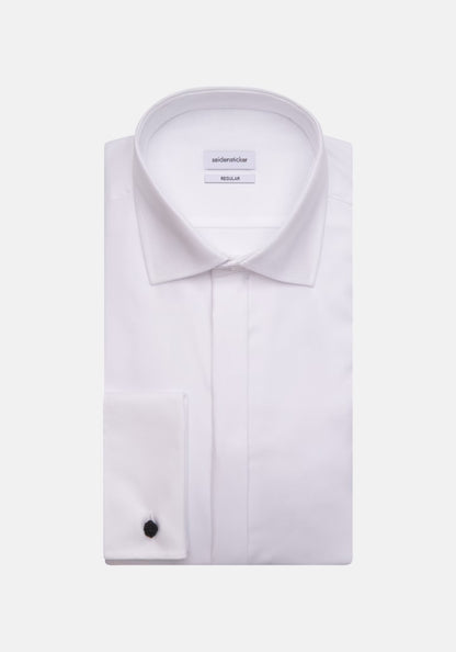 White dress shirt with black cufflink on a white background