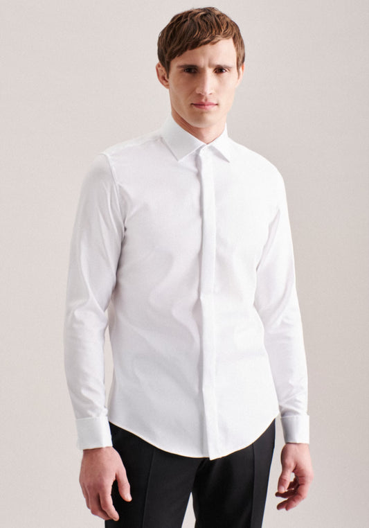 Man wearing a white dress shirt against a plain background