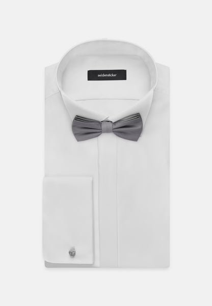 White dress shirt with a gray bow tie and cufflink on a white background