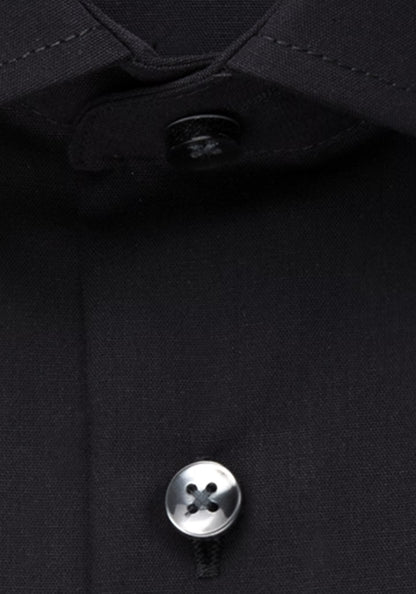 Close-up of a button on a black shirt