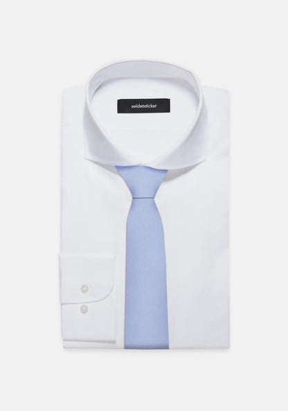 White dress shirt with a light blue tie on a white background