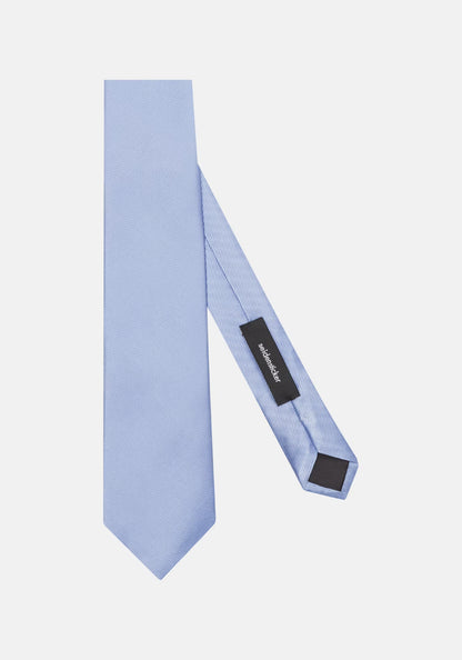 Light blue tie with a black label on a white background