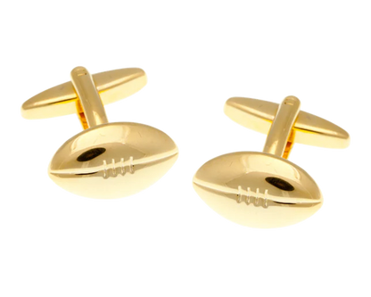 gold rugby ball cufflinks on white background