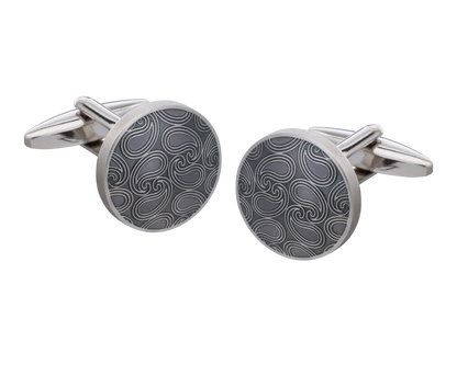 Silver cufflinks with a black pattern on a white background