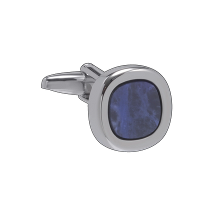 Silver cufflink with a blue stone on a white background