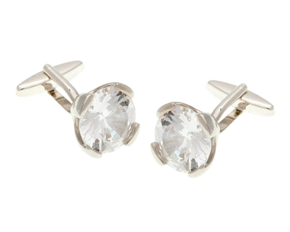 Silver cufflinks with clear gemstones on a white background