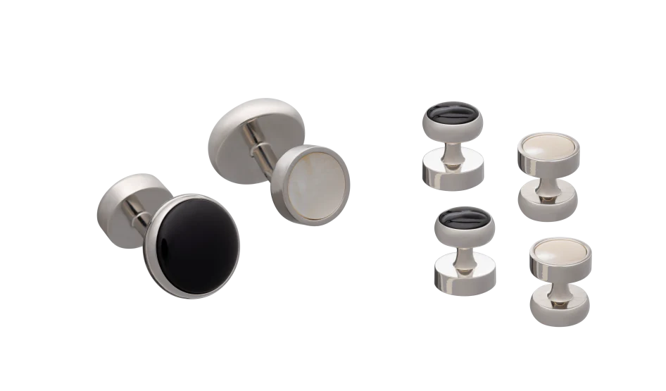 Set of silver and black button studs  on a white background