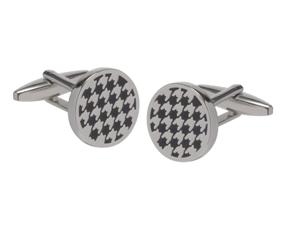 Round silver cufflinks with black houndstooth pattern on a white background