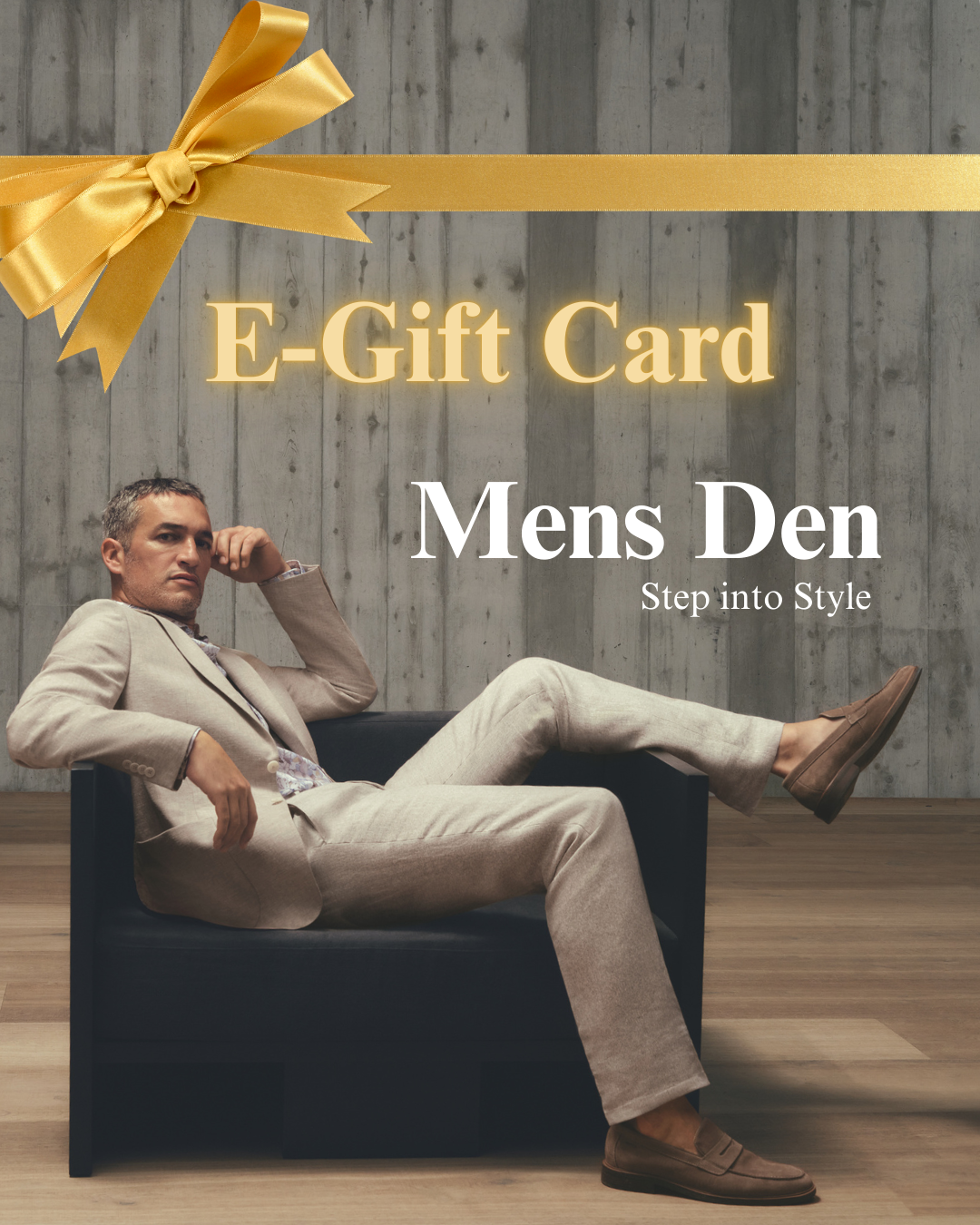 Man in a suit sitting on a chair with a large yellow bow and 'E-Gift Card Mens Den' text.