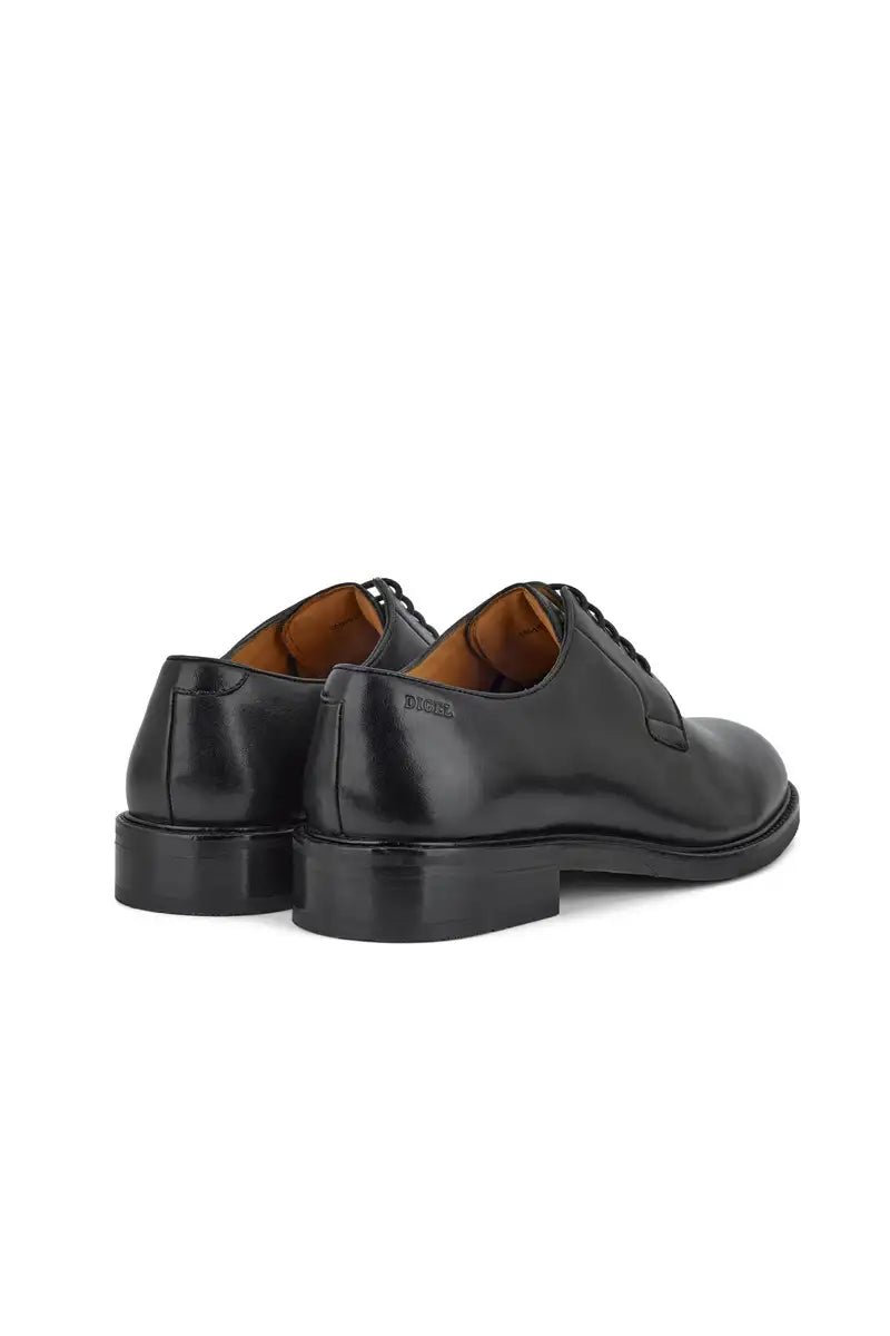 rear view black dress shoe on white background