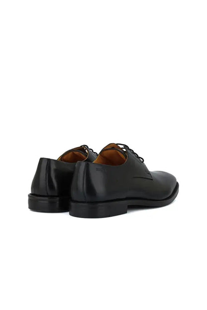 rear view black leather dress shoe on white background
