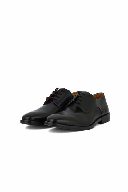 black leather dress shoe on white background