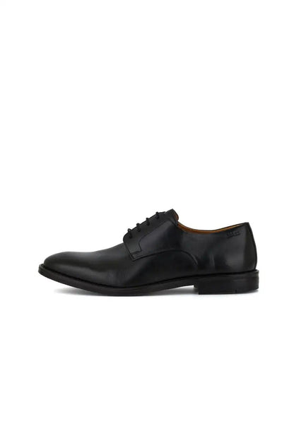 side view black leather dress shoe on white background