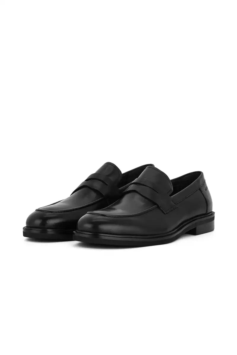 black penny loafer black shoes on white background